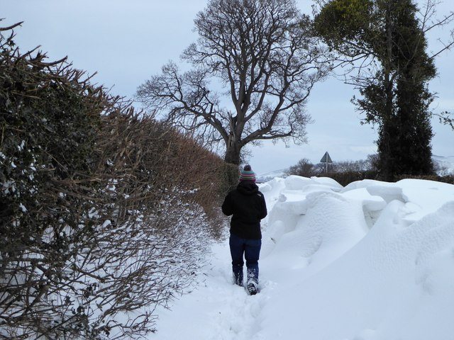 A man walks through snowdrifts